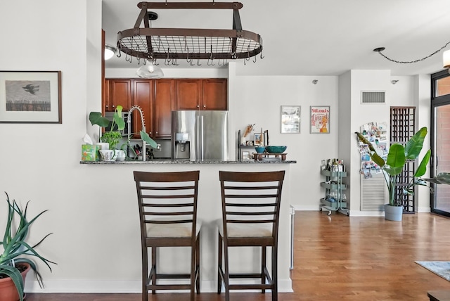 1160 S Michigan Ave Unit 1005, Chicago, IL 60605 - bar area featuring stainless steel fridge, wood finished floors, and baseboards