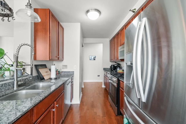 1160 S Michigan Ave Unit 1005, Chicago, IL 60605 - kitchen with appliances with stainless steel finishes, baseboards, dark wood-style floors, a sink, and dark stone countertops