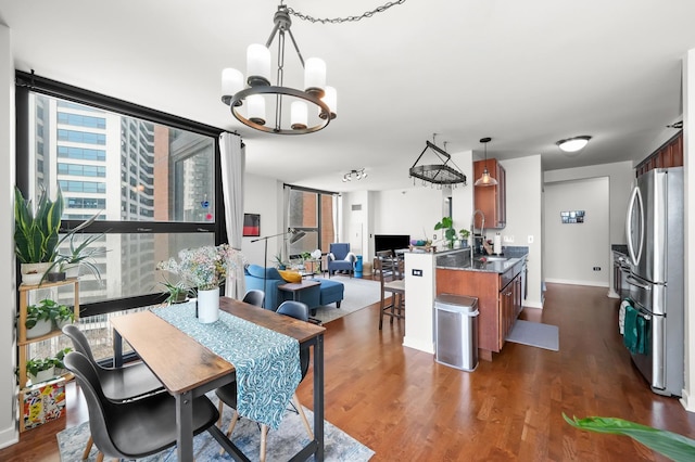 1160 S Michigan Ave Unit 1005, Chicago, IL 60605 - dining room with a chandelier, dark wood-style floors, and baseboards