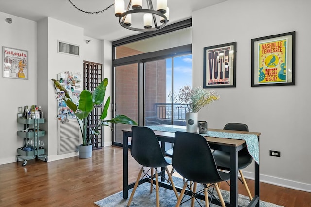 1160 S Michigan Ave Unit 1005, Chicago, IL 60605 - dining room featuring a chandelier, baseboards, and wood finished floors