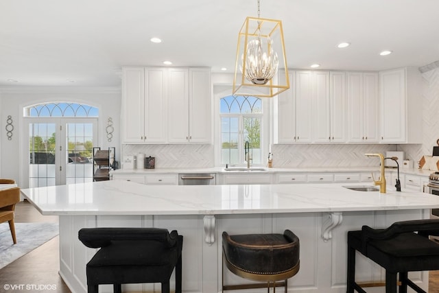 22844 Lakeview Estates Blvd, Frankfort, IL 60423 - kitchen featuring healthy amount of natural light, a sink, backsplash, recessed lighting, and ornamental molding