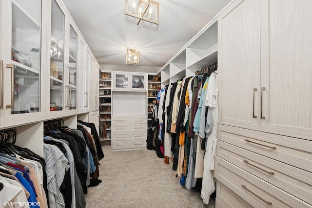 22844 Lakeview Estates Blvd, Frankfort, IL 60423 - walk in closet featuring light colored carpet and a chandelier