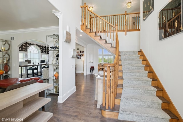 22844 Lakeview Estates Blvd, Frankfort, IL 60423 - stairs with crown molding, plenty of natural light, wood finished floors, baseboards, and arched walkways