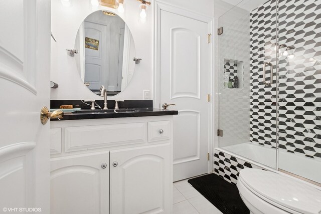 22844 Lakeview Estates Blvd, Frankfort, IL 60423 - bathroom featuring toilet, vanity, tile patterned flooring, and bath / shower combo with glass door