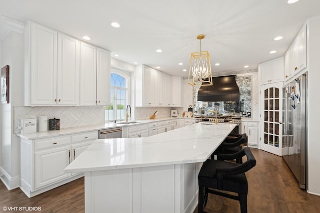 22844 Lakeview Estates Blvd, Frankfort, IL 60423 - kitchen featuring a sink, high quality appliances, backsplash, a center island with sink, and exhaust hood