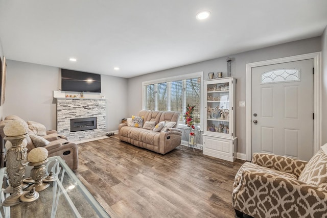31 Bruce Ct N, Lockport, IL 60441 - living area featuring a stone fireplace, baseboards, wood finished floors, and recessed lighting
