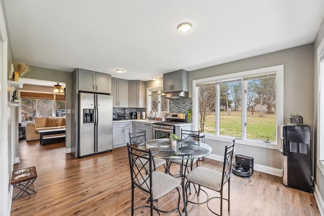 31 Bruce Ct N, Lockport, IL 60441 - dining area featuring wood finished floors, plenty of natural light, and baseboards