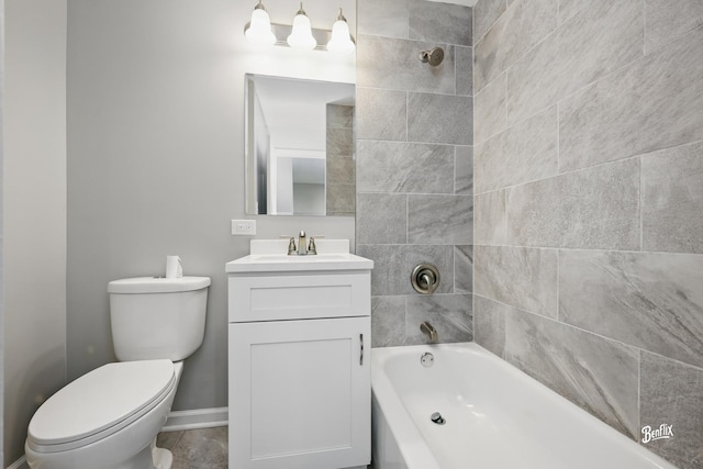 bathroom with vanity, baseboards, toilet, and shower / washtub combination