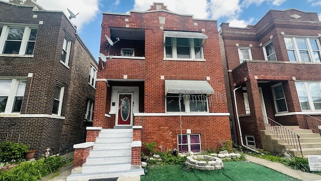 view of front of home with brick siding