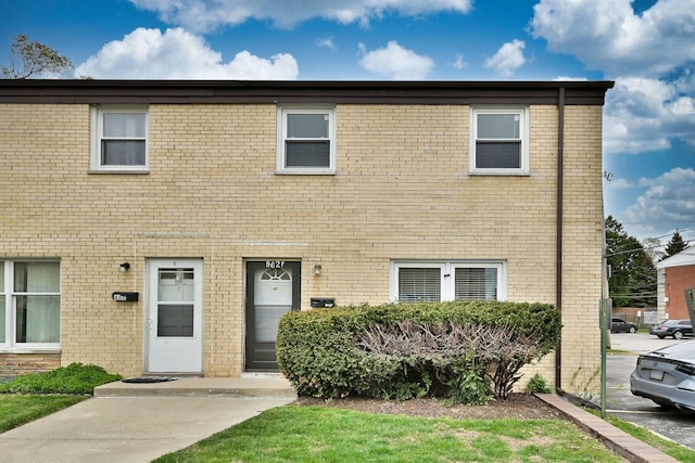 view of property with brick siding