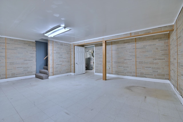 finished below grade area with water heater, stairway, and baseboards