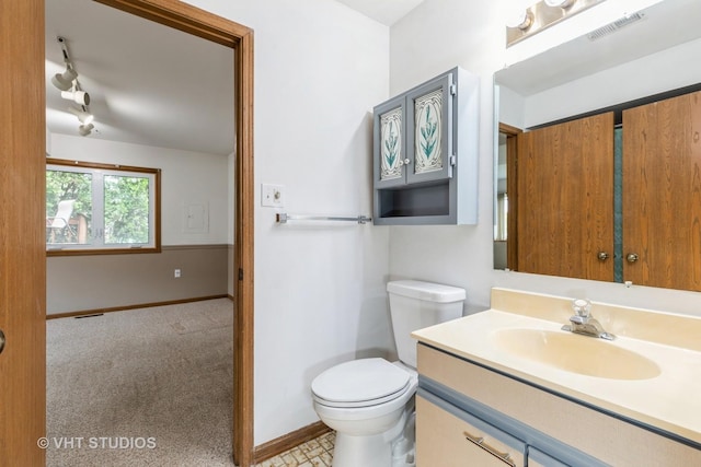 17581 Windsor Pkwy Unit 1, Tinley Park, IL 60477 - bathroom with toilet, baseboards, and vanity