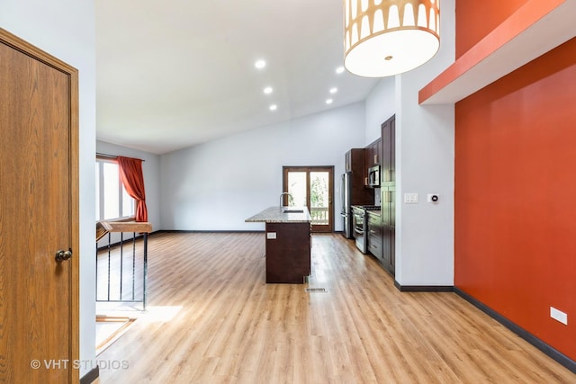 17581 Windsor Pkwy Unit 1, Tinley Park, IL 60477 - kitchen with stainless steel appliances, light wood-style flooring, baseboards, a high ceiling, and recessed lighting