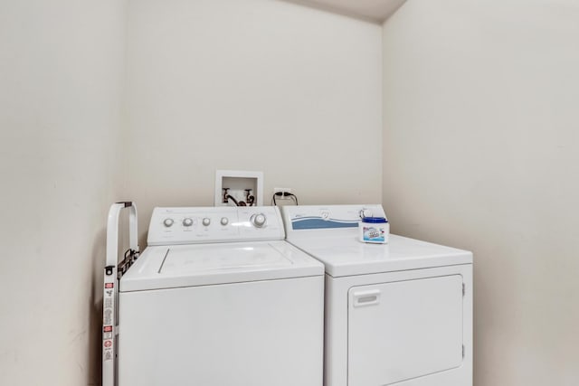 laundry area with washing machine and clothes dryer