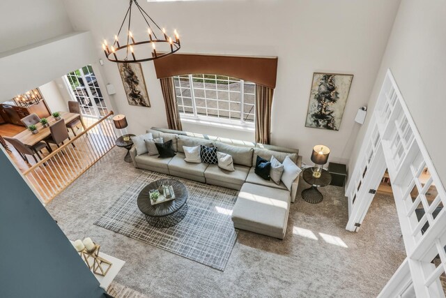 living room with a chandelier and carpet