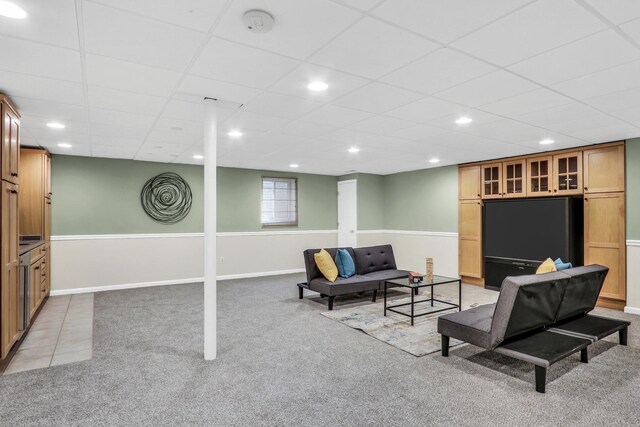 living area with light colored carpet, recessed lighting, baseboards, and a drop ceiling