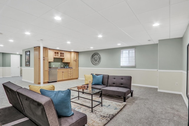 living room with light colored carpet, baseboards, recessed lighting, and a paneled ceiling