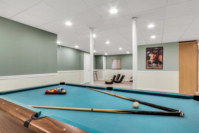 game room with billiards table, a wainscoted wall, carpet, and a paneled ceiling