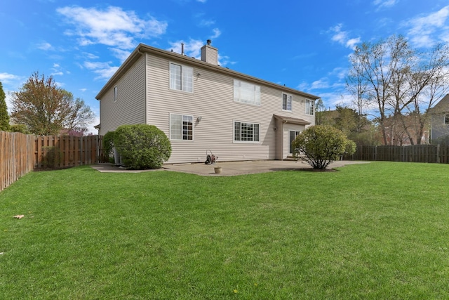 back of house with a patio and a chimney