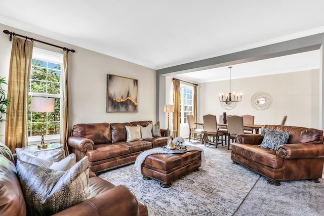 carpeted living area featuring a chandelier, healthy amount of natural light, and crown molding