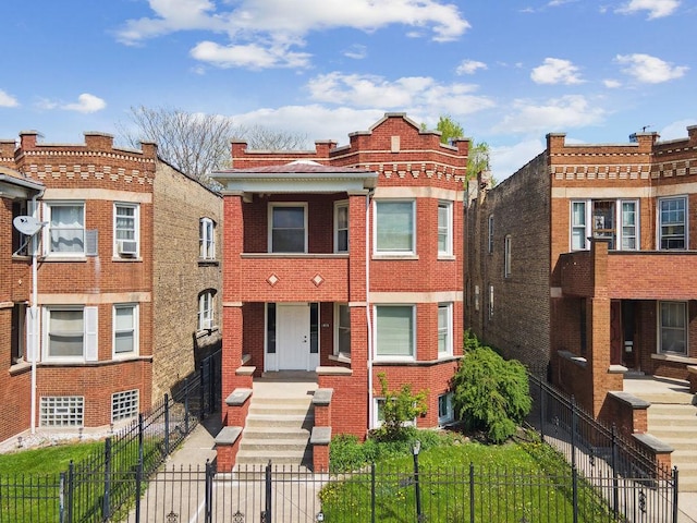 1235 N Mason Ave, Chicago, IL 60651 - view of front of home featuring brick siding and a fenced front yard