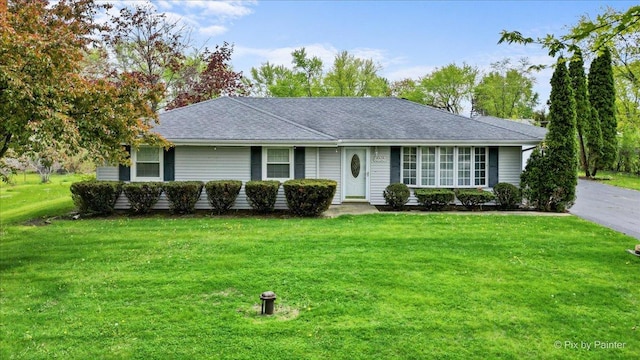 3700 Theodore St, Joliet, IL 60431 - ranch-style home with a front lawn and roof with shingles