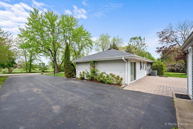 3700 Theodore St, Joliet, IL 60431 - view of side of home featuring central AC unit and a patio area