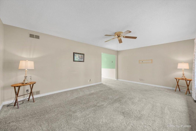 3700 Theodore St, Joliet, IL 60431 - carpeted empty room with a ceiling fan, a textured ceiling, and baseboards