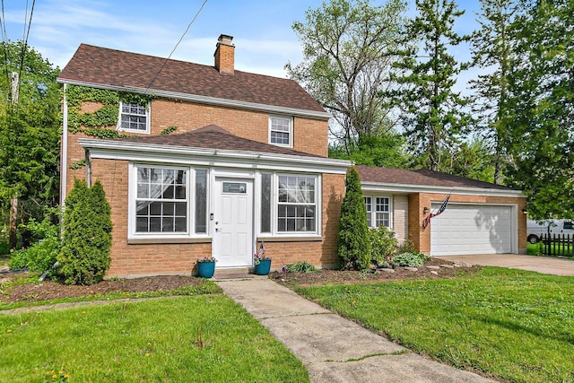 616 Kirk Ave, Elgin, IL 60120 - traditional-style home with a chimney, a front lawn, concrete driveway, brick siding, and an attached garage