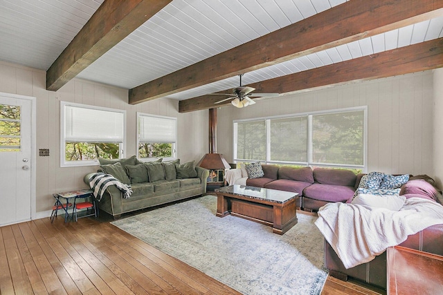 616 Kirk Ave, Elgin, IL 60120 - living room featuring wood-type flooring, plenty of natural light, beam ceiling, ceiling fan, and wood walls