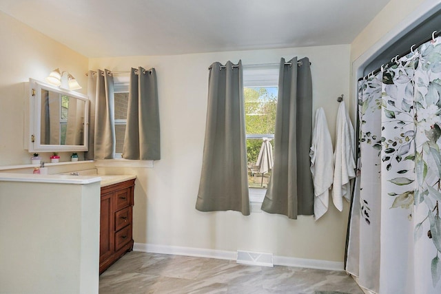 616 Kirk Ave, Elgin, IL 60120 - bathroom with vanity and baseboards