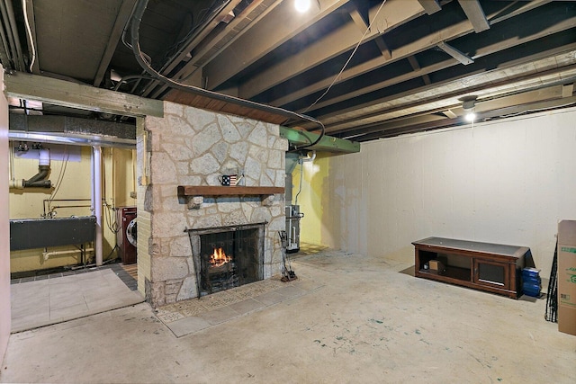 616 Kirk Ave, Elgin, IL 60120 - unfinished basement with a sink, washer and dryer, and a stone fireplace