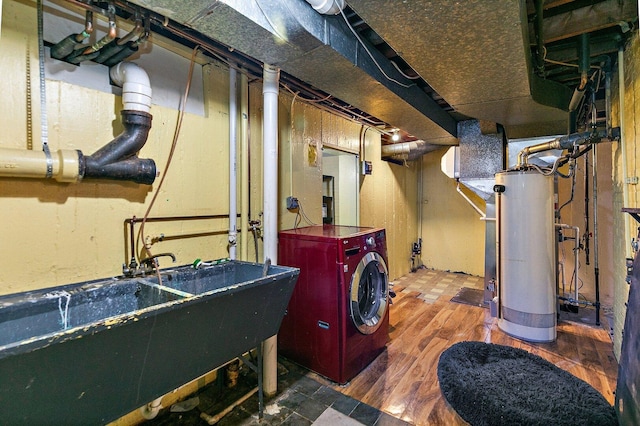 616 Kirk Ave, Elgin, IL 60120 - unfinished basement with gas water heater, washer / dryer, wood finished floors, and a sink
