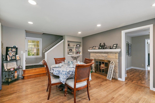 616 Kirk Ave, Elgin, IL 60120 - dining space with stairs, light wood-type flooring, a fireplace, baseboards, and recessed lighting