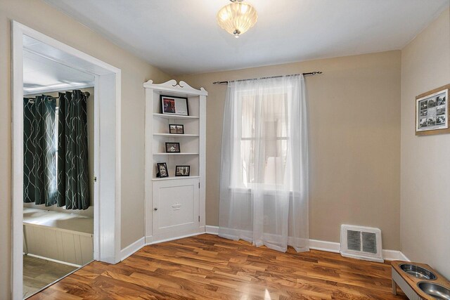 616 Kirk Ave, Elgin, IL 60120 - unfurnished dining area featuring wood finished floors and baseboards