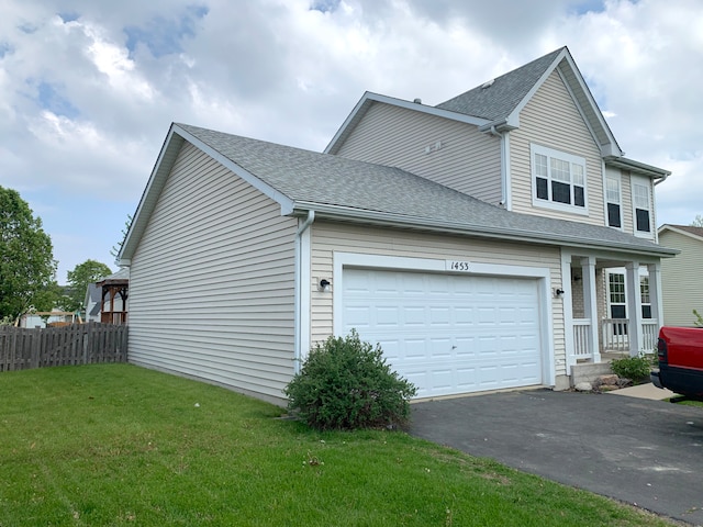 1453 Bluestem Ln, Minooka, IL 60447 - view of side of home featuring asphalt driveway, a shingled roof, and a garage