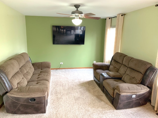 1453 Bluestem Ln, Minooka, IL 60447 - living area featuring carpet flooring, ceiling fan, and baseboards