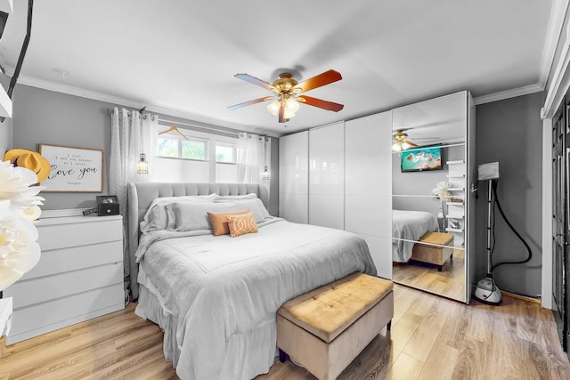 1156 N Fischer Dr, Addison, IL 60101 - bedroom with ornamental molding, light wood-style floors, a closet, and ceiling fan