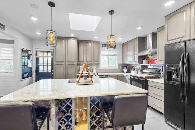 1156 N Fischer Dr, Addison, IL 60101 - kitchen with wall chimney range hood, black appliances, gray cabinets, a kitchen breakfast bar, and recessed lighting