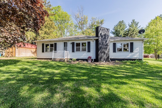 403 W Main St, Malden, IL 61337 - ranch-style house featuring a chimney and a front lawn