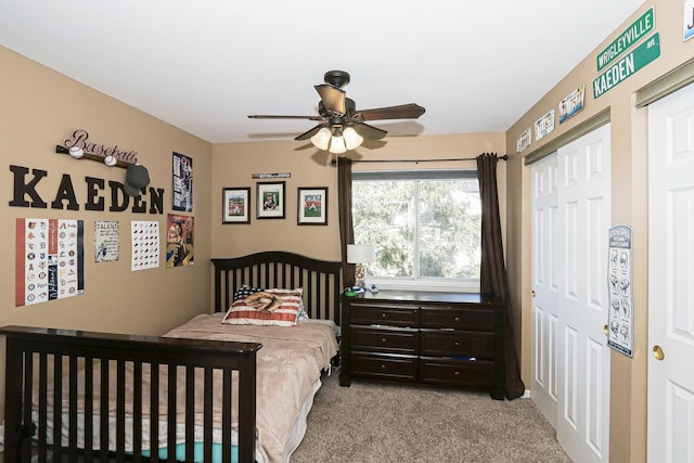 carpeted bedroom with ceiling fan