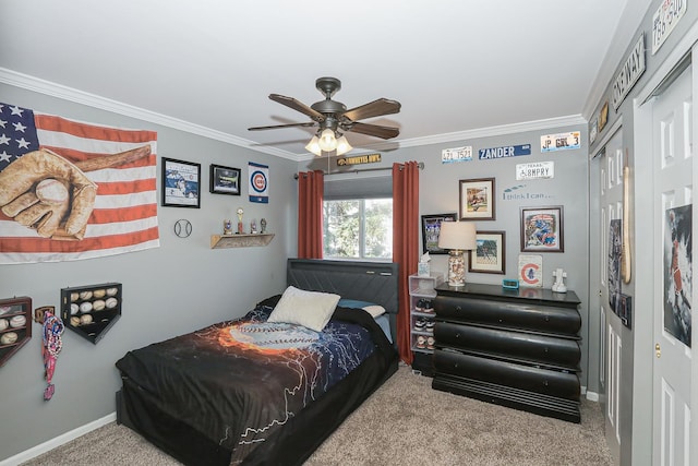 carpeted bedroom featuring baseboards, a closet, ornamental molding, and ceiling fan