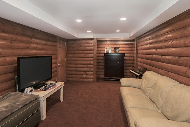 living room with log walls, dark carpet, and recessed lighting