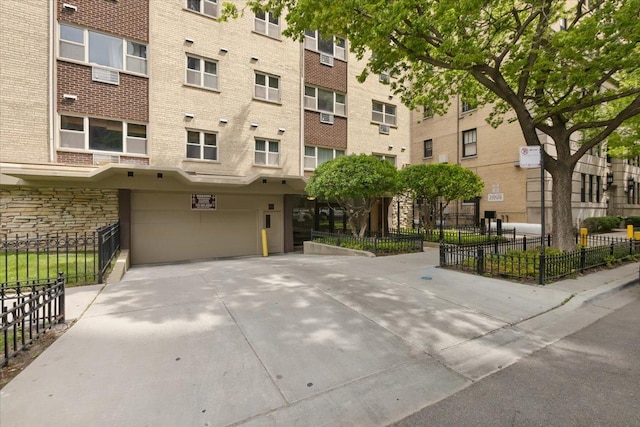 420 W Aldine Ave Unit 405, Chicago, IL 60657 - view of property with an attached garage and driveway