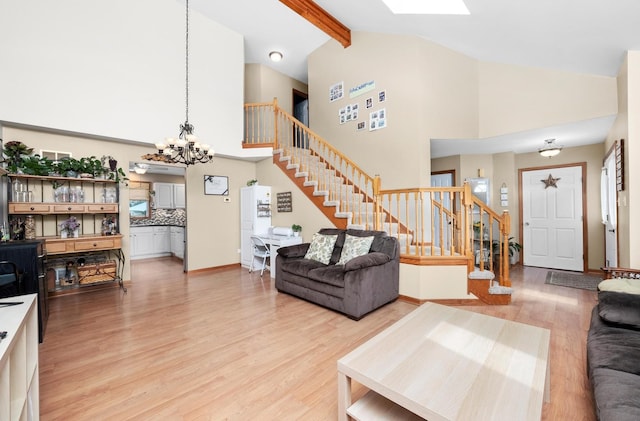 5157 Ribbon Ct, Monee, IL 60449 - living room featuring stairs, a chandelier, light wood finished floors, high vaulted ceiling, and beamed ceiling