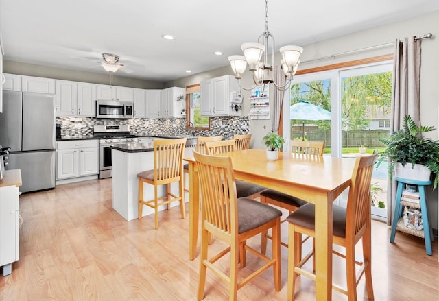 5157 Ribbon Ct, Monee, IL 60449 - dining room featuring a chandelier, light wood-type flooring, ceiling fan, and recessed lighting