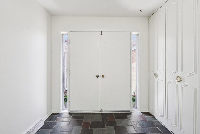entrance foyer featuring stone tile flooring