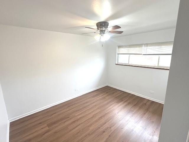 2209 171st St, Hazel Crest, IL 60429 - spare room featuring a ceiling fan, wood finished floors, and baseboards