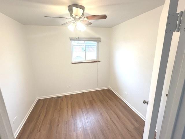 2209 171st St, Hazel Crest, IL 60429 - unfurnished room featuring wood finished floors, ceiling fan, and baseboards