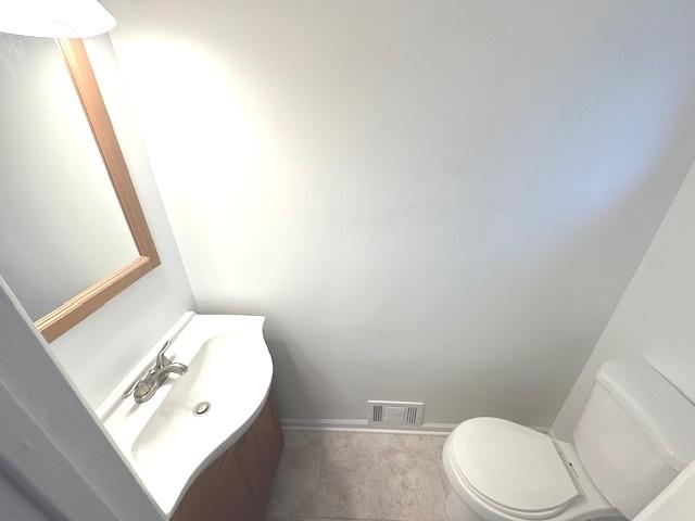 2209 171st St, Hazel Crest, IL 60429 - half bath with toilet, vanity, and baseboards